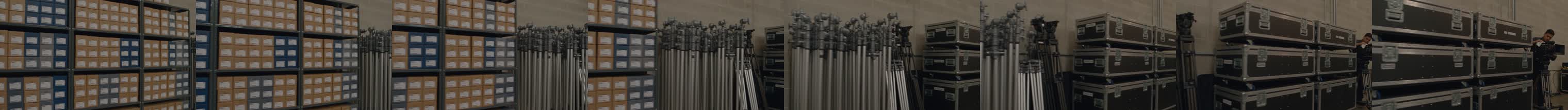 Eight frames from the tracking shot: lens cases, tripods, flight cases, technician