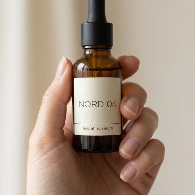 Serum bottle held in a hand